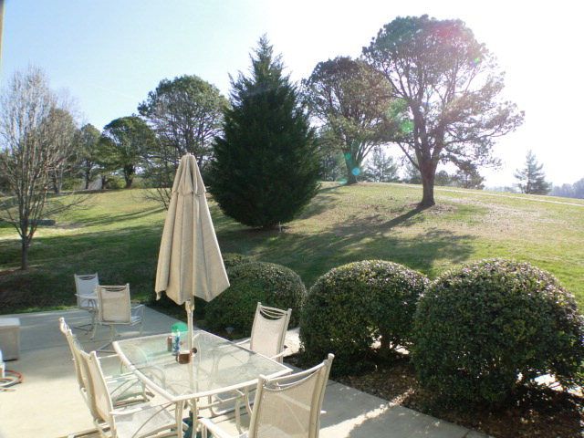 Sip your morning coffee from the patio overlooking the 2nd fairway of Mill Creek, Golf Course Properties for Sale in the Mountains, John Becker Bald Head Franklin NC