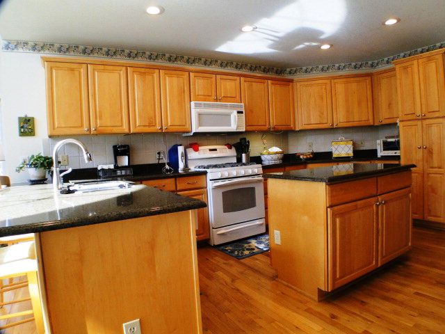 This is a large country kitchen with a family room on one side and formal dining on the other side, Franklin NC Golf Home for Sale, Upscale Properties FranklinNC