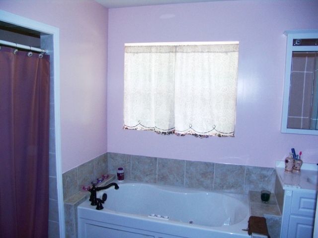 You're sure to enjoy the jetted tub in the master bath- grab a glass of wine and a book and slide on in, 4 bedroom home for sale in Franklin NC