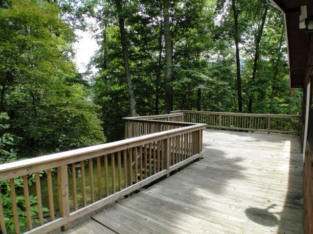 This deck will surely be the spot for many parties and barbeques,  Bedroom Home for Sale in Cullowhee NC, Lake Glenville Cabins for Sale