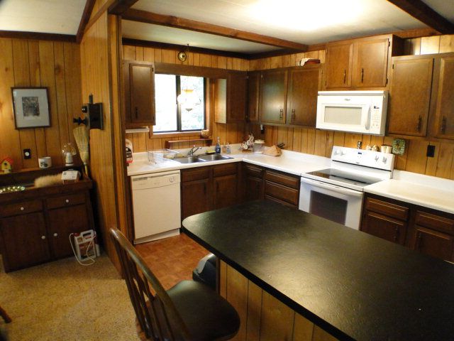 A country kitchen that is sure to be the center of activity in your mountain home, Bald Head Realty Cullowhee NC
