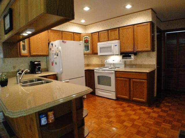 The kitchen has plenty of room for several chefs and is adjacent to the living and dining rooms, John Becker Bald Head Realty