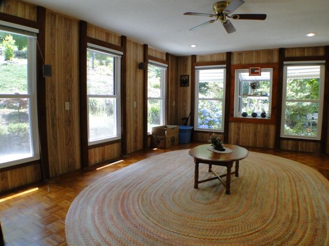 Awesome sunroom with tons of dual-pane thermal windows and a greenhouse window for herbs, Franklin NC Farm for Sale