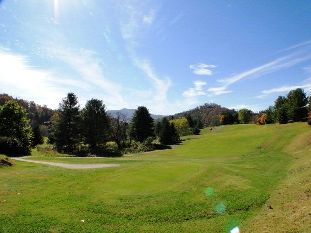 There is a lovely screened porch overlooking the 17th fairway with a YEAR ROUND LONG RANGE VIEW, Mill Creek Villas Franklin NC, Retire in Franklin NC