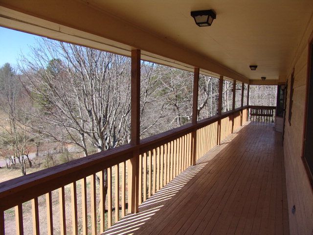 A large covered deck goes all along the front of the home, Franklin NC Homes for Sale