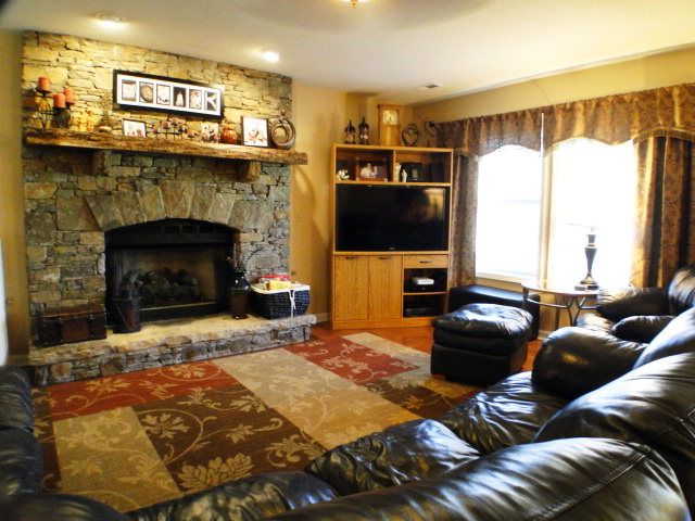 Living room with rock fireplace-Home for sale in Franklin NC