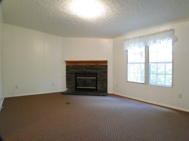 The home has new carpet and paint and BIG vaulted ceilings which make the home feel even larger, Franklin NC Homes for Sale