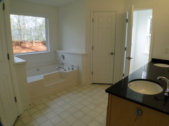 Beautiful master bathroom with HIS and HERS closets dual vanities shower and a garden tub, Franklin NC Homes for Sale on Acreage, Franklin NC Homes with Views