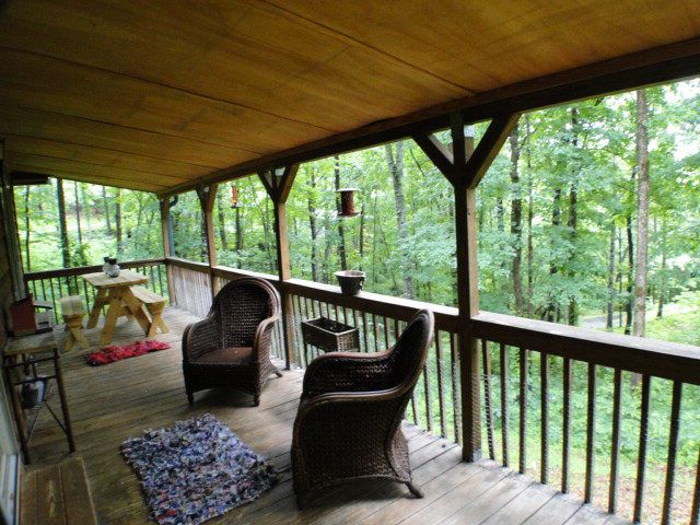 There's a nice covered deck for enjoying the wooded surroundings
