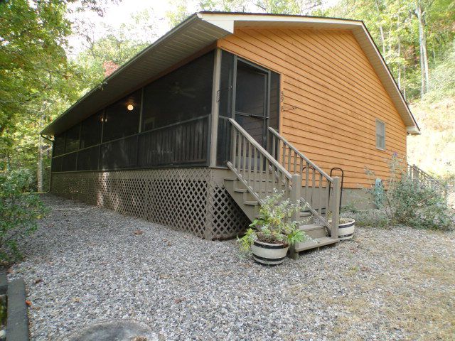 2 Bedroom, 2 Bath home with a nice vaulted ceiling rock fireplace cheerful country kitchen and open floor plan, 59 Sherry Lane Franklin NC, Keller Williams Realty