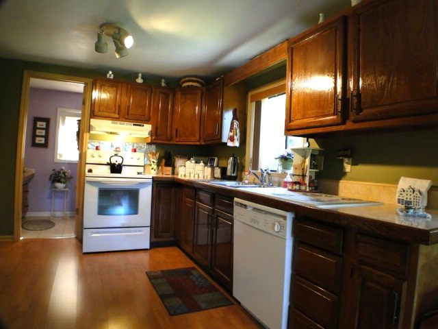 This kitchen has nice cabinets and tile countertops, Chalet for Sale in Franklin NC