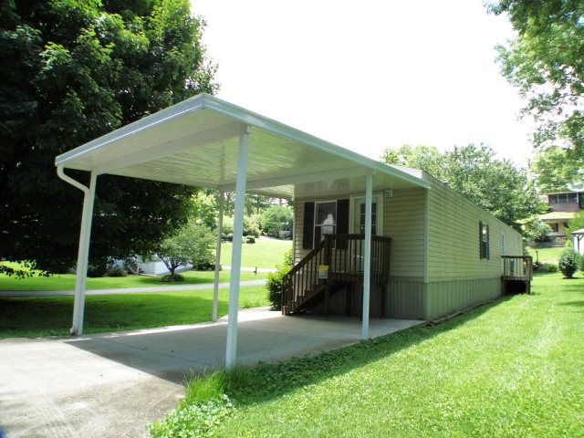 The attached carport makes life easy in this mobile home community in Franklin NC, 55+ Communities Franklin NC