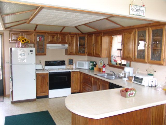 The home has a large country kitchen with nice wood cabinets and plenty of counter space for working, Bald Head Realty Franklin NC, John Becker Listings