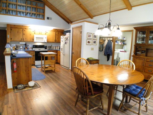 This home for sale in Franklin NC has a great country kitchen that's open to the living and dining areas, Bald Head the Realtor