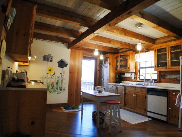 Cook up some farmhouse fixins in the large country kitchen of this home in Franklin NC, Franklin NC Log Cabins for Sale, Equestrian Estate in the Mountains