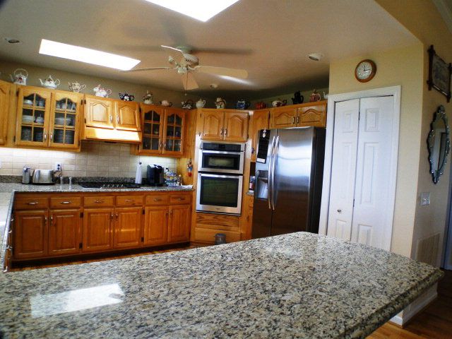 A large open kitchen that's gourmet to the core!  Stainless steel appliances, granite counters, pantry - who could ask for more?