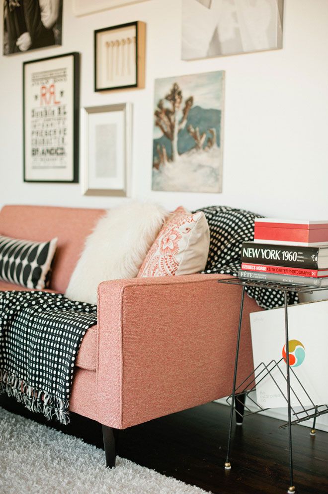 ETC INSPIRATION BLOG DESIGN INTERIOR SWEDISH MID CENTURY INSPIRED PINK SALMON COUCH SOFA BLACK WHITE GRAPHIC PRINT BLANKETS PILLOWS FRAMED WALL PICTURES PHOTO BOOKS METAL SHELF FURRY FUZZY WHITE RUG MONGOLIAN FUR THROW PILLOW JEREMY HARWELL PHOTOGRAPHER